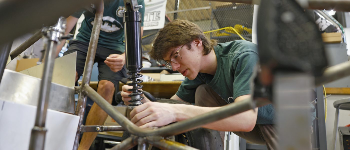 Students working in the Kulwicki Motorsports Laboratory